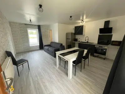 Télévision ou salle de divertissement dans l'établissement Le Clos des Cadots - Suites équipées