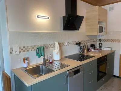 Cuisine ou kitchenette dans l'établissement La maison du lavoir