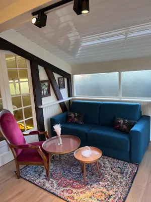 Coin salon dans l'établissement Cottage Apolline