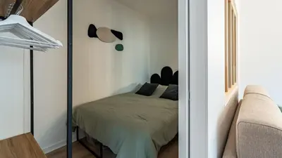 Un ou plusieurs lits dans un hébergement de l'établissement Casa Nena, nid douillet , quartier BSB, République