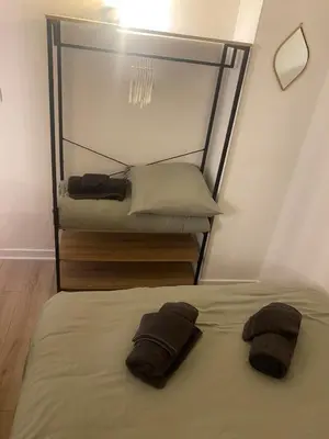 Un ou plusieurs lits dans un hébergement de l'établissement Casa Nena, nid douillet , quartier BSB, République
