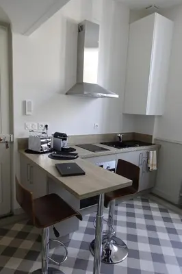Cuisine ou kitchenette dans l'établissement Lons-le Saunier Appartement Site remarquable