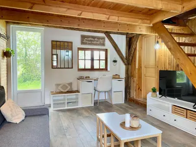 Télévision ou salle de divertissement dans l'établissement Aux petites portes du Morvan