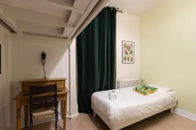 Un ou plusieurs lits dans un hébergement de l'établissement Cabana & Maison des Vignes