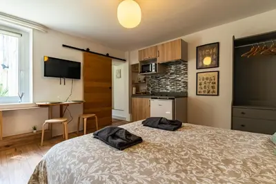 Un ou plusieurs lits dans un hébergement de l'établissement Le cosy * Charmant * Studio