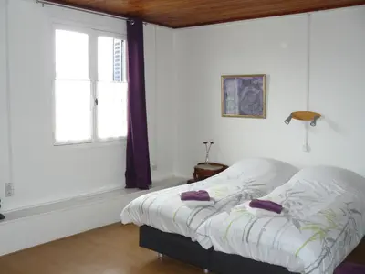 Un ou plusieurs lits dans un hébergement de l'établissement Auberge Fleurie