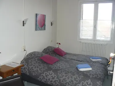 Un ou plusieurs lits dans un hébergement de l'établissement Auberge Fleurie