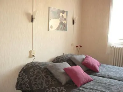 Un ou plusieurs lits dans un hébergement de l'établissement Auberge Fleurie