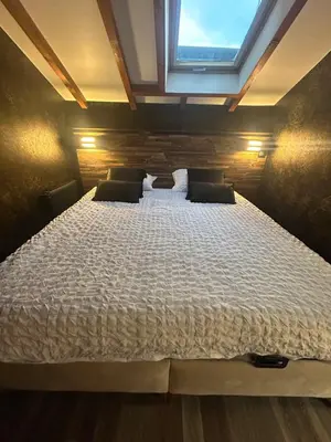 Un ou plusieurs lits dans un hébergement de l'établissement Appart hôtel le 8 La Suite - parking gratuit -