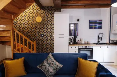 Cuisine ou kitchenette dans l'établissement Appart hôtel le 8 La Suite - parking gratuit -