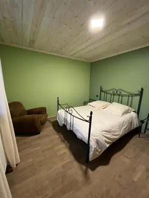 Un ou plusieurs lits dans un hébergement de l'établissement Maison de campagne