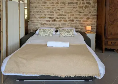 Un ou plusieurs lits dans un hébergement de l'établissement Cabana & Domaine Raison