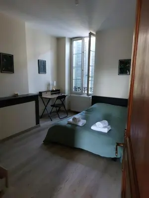 Un ou plusieurs lits dans un hébergement de l'établissement Appartement cosy tout confort