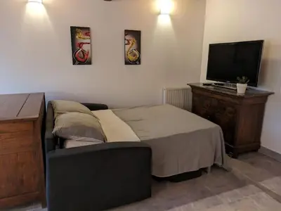 Un ou plusieurs lits dans un hébergement de l'établissement Au bout du Ciel - Maison avec garage, terrasse, cave