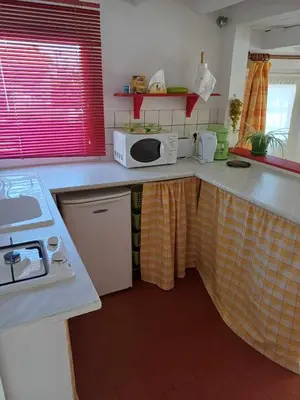 Cuisine ou kitchenette dans l'établissement Studio meublé