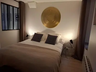 Un ou plusieurs lits dans un hébergement de l'établissement Joli appartement au coeur de Mâcon