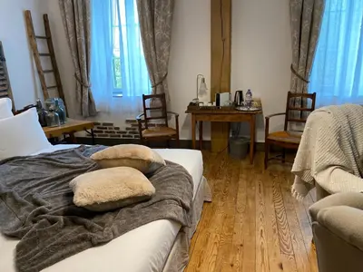 Coin salon dans l'établissement Le Moulin de Visargent