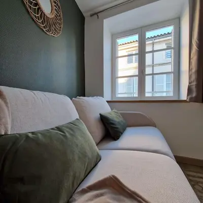 Un ou plusieurs lits dans un hébergement de l'établissement Studio Rue Carnot Le St Pierre