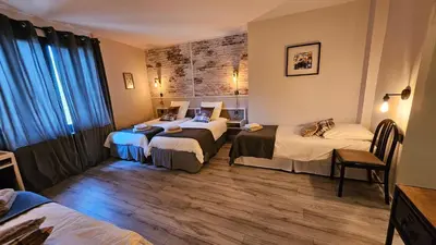 Un ou plusieurs lits dans un hébergement de l'établissement Auberge de la Marine