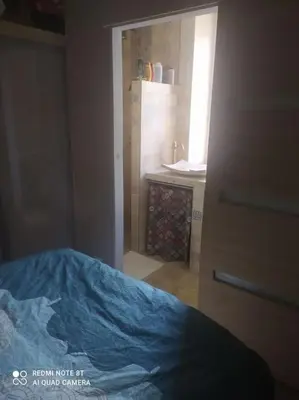 Un ou plusieurs lits dans un hébergement de l'établissement Charmant Appartement 2 pièces avec extérieur