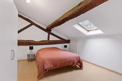 Un ou plusieurs lits dans un hébergement de l'établissement Les chambres Tonics