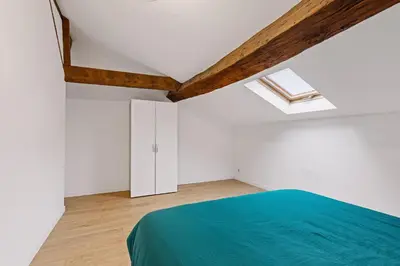 Un ou plusieurs lits dans un hébergement de l'établissement Les chambres Tonics
