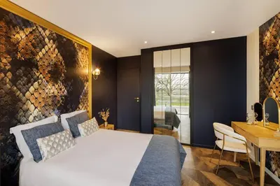 Un ou plusieurs lits dans un hébergement de l'établissement La Maison Rossi, Demeure chic