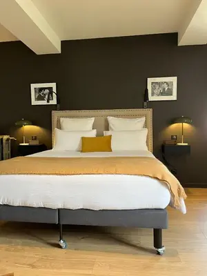 Un ou plusieurs lits dans un hébergement de l'établissement L'Hotel Particulier