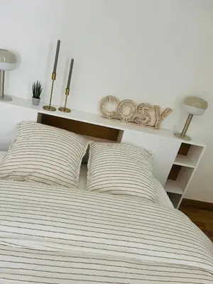 Un ou plusieurs lits dans un hébergement de l'établissement La Maison Cosy