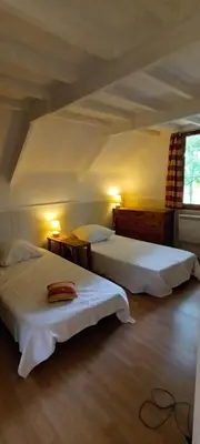 Un ou plusieurs lits dans un hébergement de l'établissement Gîte du Colombier