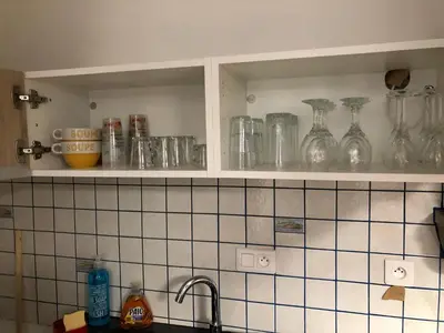 Cuisine ou kitchenette dans l'établissement Au passage