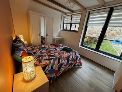Un ou plusieurs lits dans un hébergement de l'établissement Le Patio de l'Abbaye