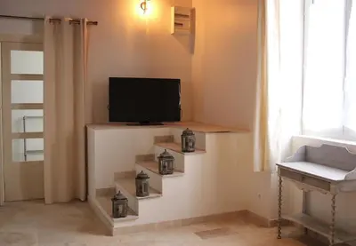 Télévision ou salle de divertissement dans l'établissement Le relais