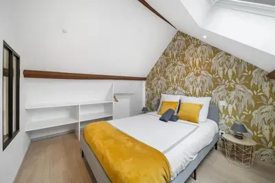Un ou plusieurs lits dans un hébergement de l'établissement Le Duplex Moutarde, prox centre et Gare, 50m2, climatisation