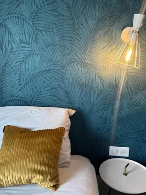 Un ou plusieurs lits dans un hébergement de l'établissement Hôtel de France - Beaune