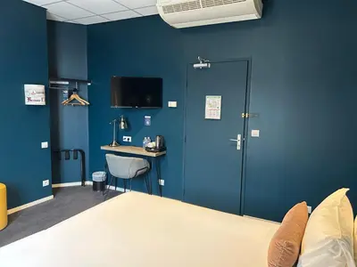 Un ou plusieurs lits dans un hébergement de l'établissement Hôtel de France - Beaune