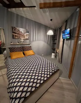 Un ou plusieurs lits dans un hébergement de l'établissement Studio cosy, cité gastronomique