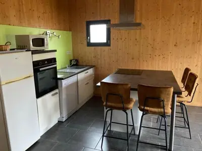 Cuisine ou kitchenette dans l'établissement Lodge détente et spa