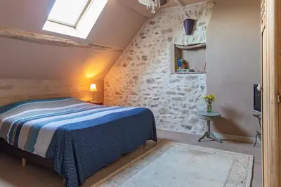 Un ou plusieurs lits dans un hébergement de l'établissement Le Theureau B&B
