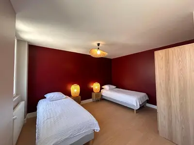 Un ou plusieurs lits dans un hébergement de l'établissement Chez Romain - Appartement au coeur de Meursault