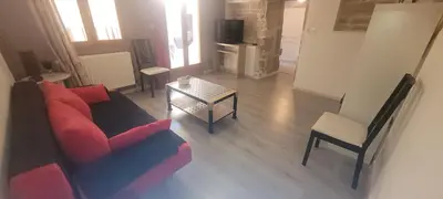 Coin salon dans l'établissement Appartement duplex avec balcons
