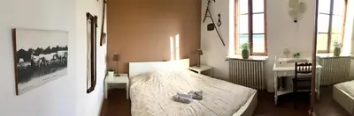 Un ou plusieurs lits dans un hébergement de l'établissement Manoir Bnburgundy 8 P