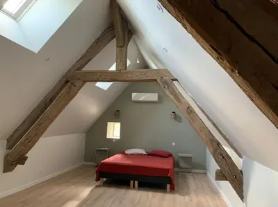 Un ou plusieurs lits dans un hébergement de l'établissement Maison de vacances