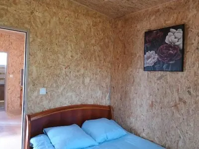 Un ou plusieurs lits dans un hébergement de l'établissement Gîte Bleu Confort et Nature