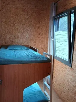 Un ou plusieurs lits dans un hébergement de l'établissement Gîte Bleu Confort et Nature