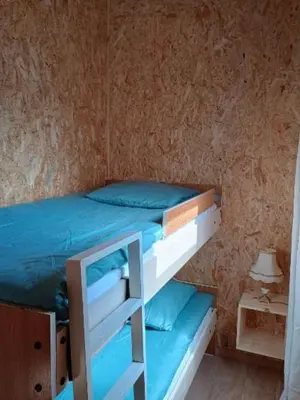 Un ou plusieurs lits dans un hébergement de l'établissement Gîte Bleu Confort et Nature