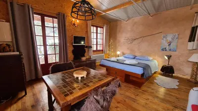 Un ou plusieurs lits dans un hébergement de l'établissement CHALET DES CHEVREUILS -les chalets de Montsermage