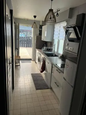 Cuisine ou kitchenette dans l'établissement Escale du parc
