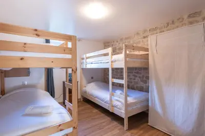 Un ou plusieurs lits dans un hébergement de l'établissement Cabana & Maison sur les hauteurs - Proche Cluny
