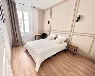 Un ou plusieurs lits dans un hébergement de l'établissement AppartNuit